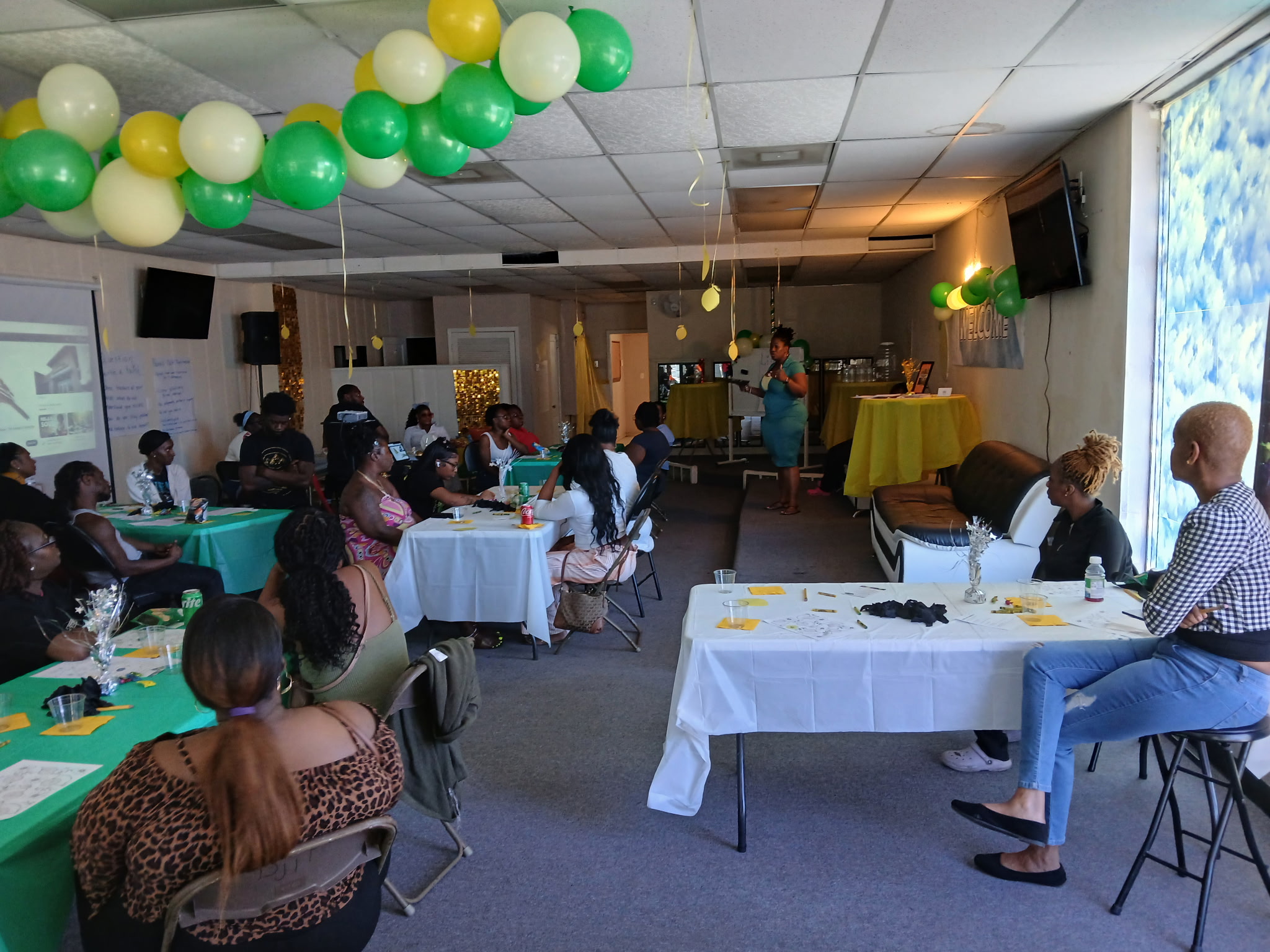 An image of four children standing side by side in an indoor setting. They are all looking at the camera wearing beige and...