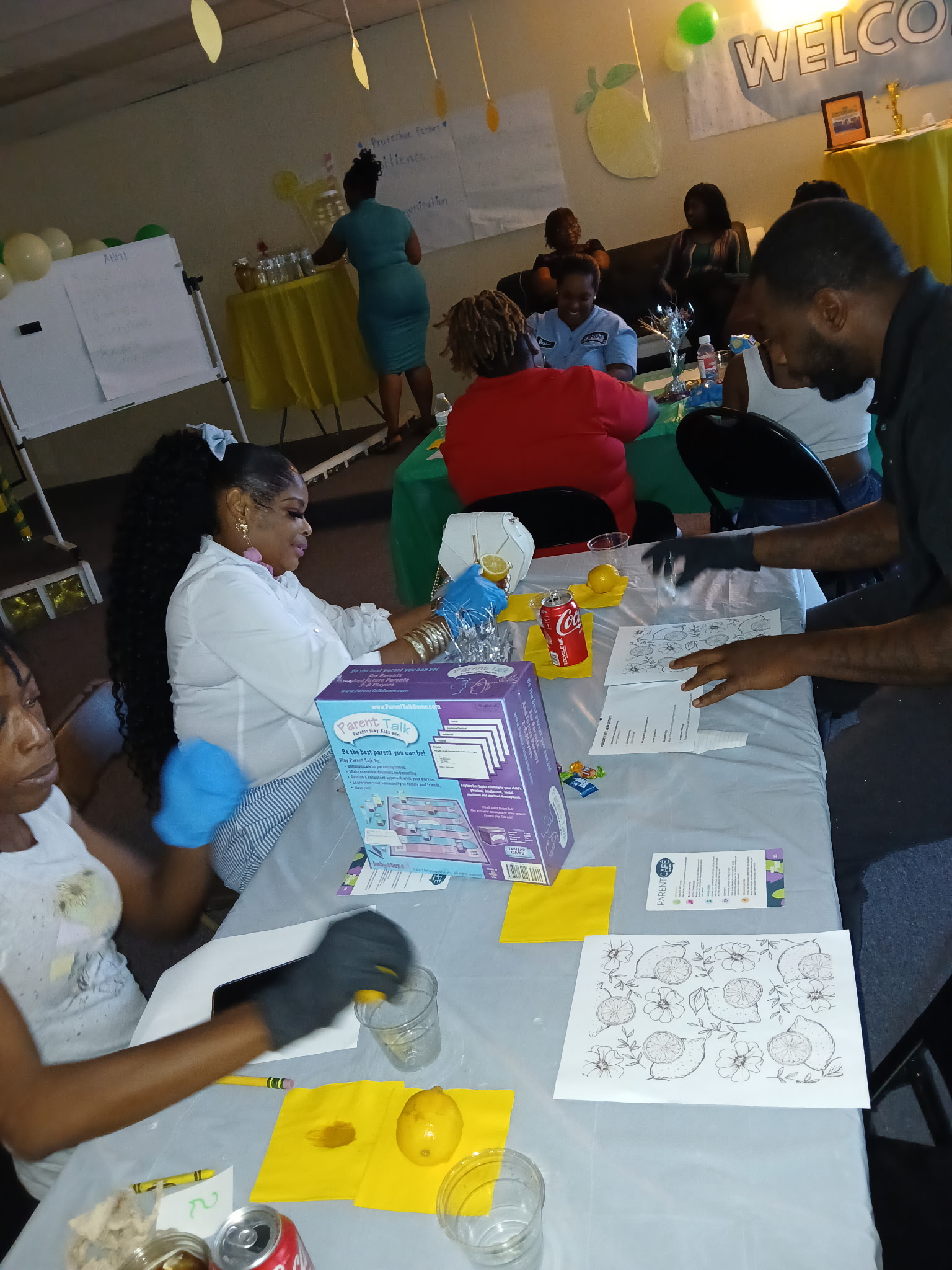 Here is the alt text for the image: A stack of eight soft, flexible plastic cups in shades of brown, blue, and oatmeal, se...